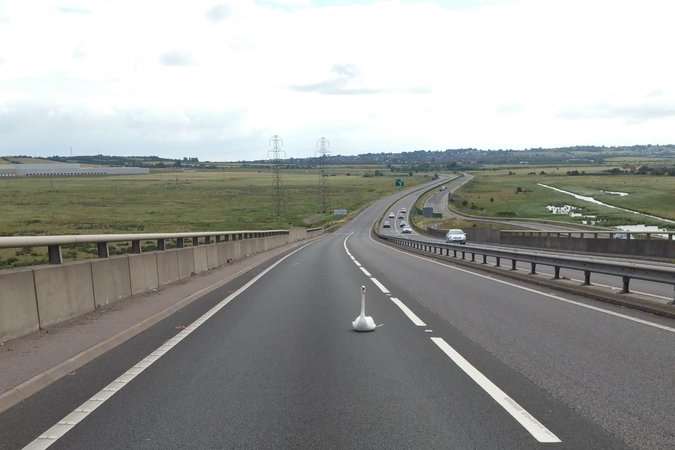 The swan settled down on the carriageway. Picture: Kent Police Swale