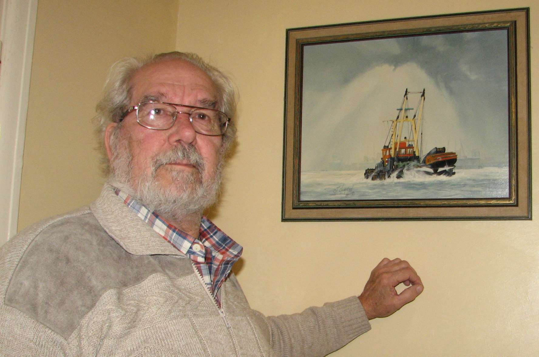 Derek Collins with a portrait of the Medway Rhino at his home