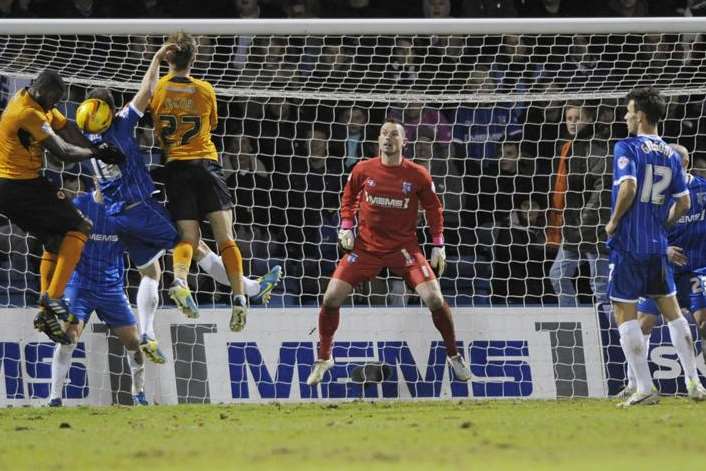 Gillingham's defence defend in numbers as Wolves step up the pressure. Picture: Barry Goodwin