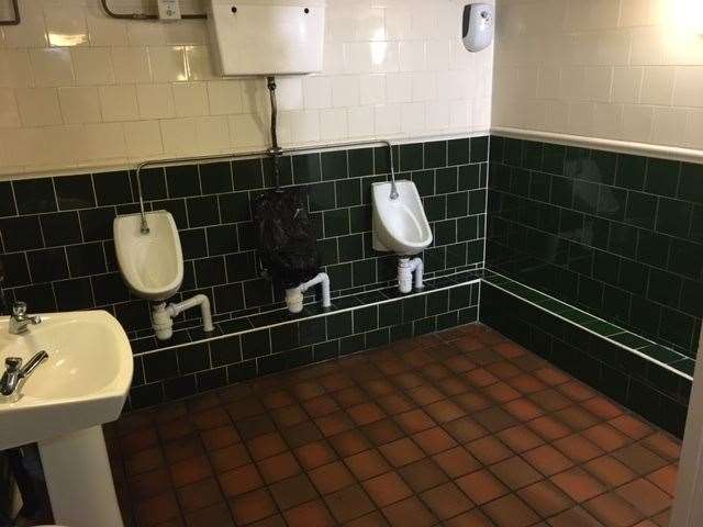 Decorated with dark green tiles and painted white, the toilets are well maintained, clean and fresh