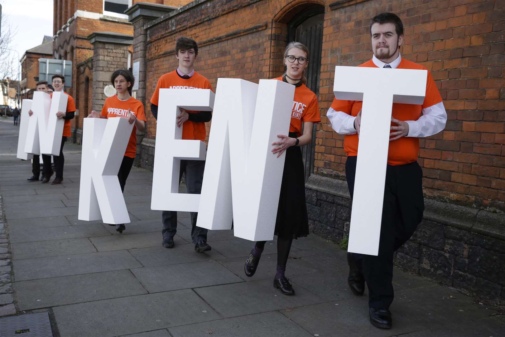 Apprentices carried letters bearing the name "Made In Kent" to launch a campaign by Kent County Council