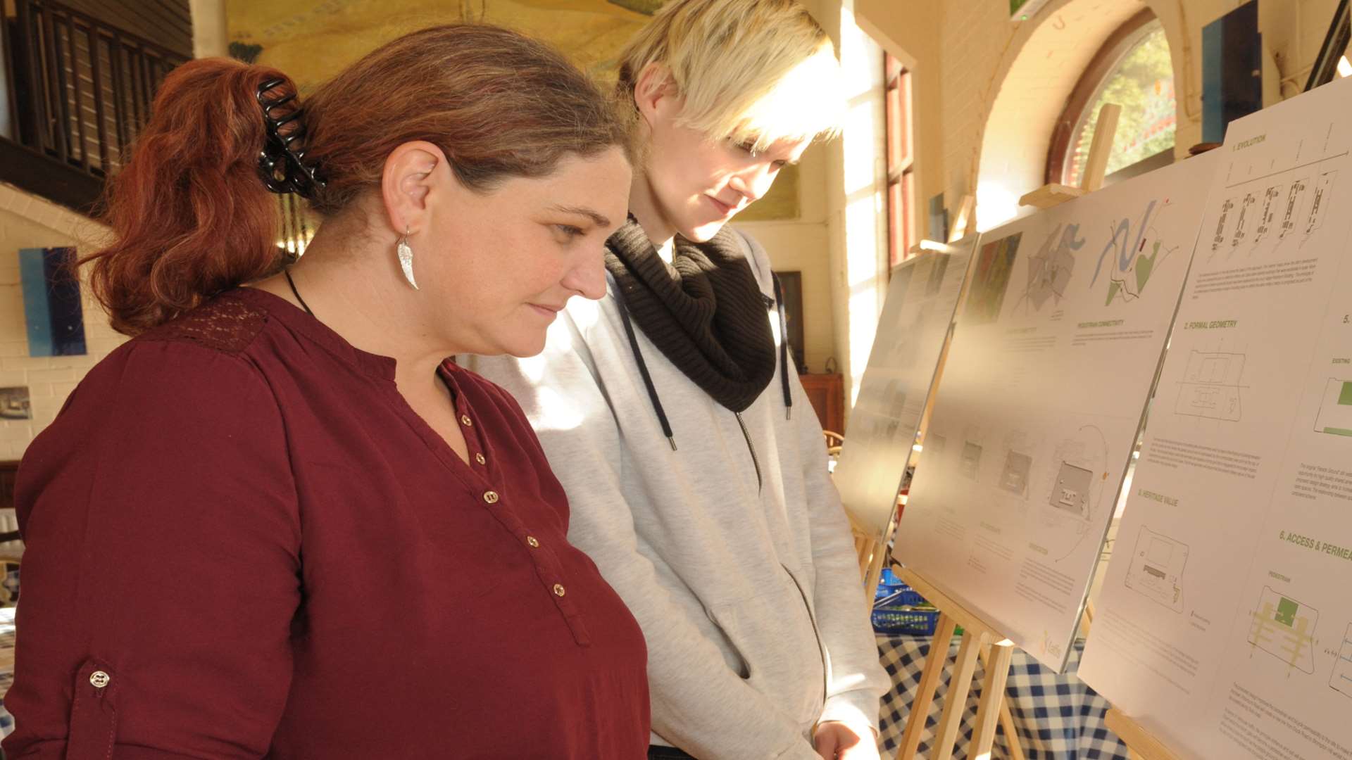 Donna Langford-Hodges and Alice Cook check out the plans. Picture: Steve Crispe.