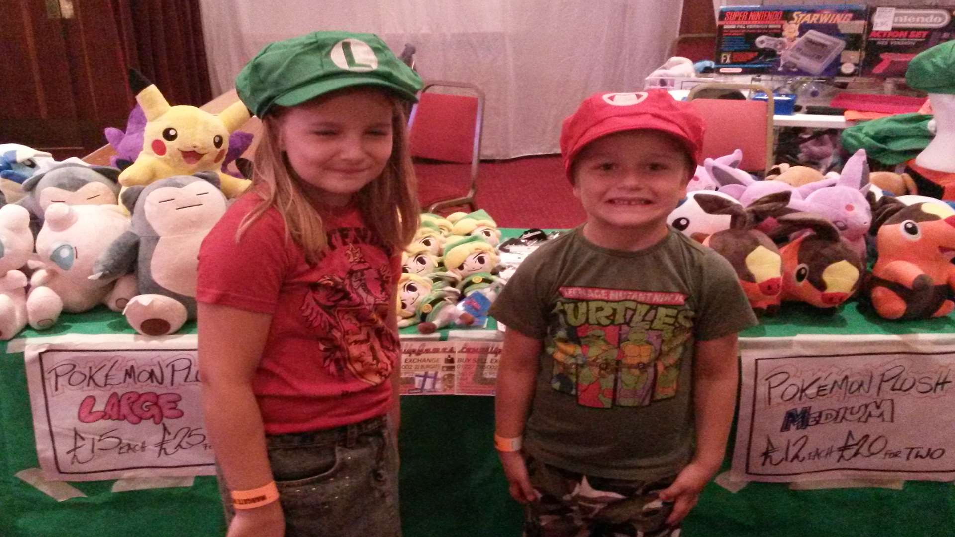 Lilah Ainsworth, 8, and her five-year-old brother Ted, try on Mario and Luigi hats at Margate's Winter Gardens.
