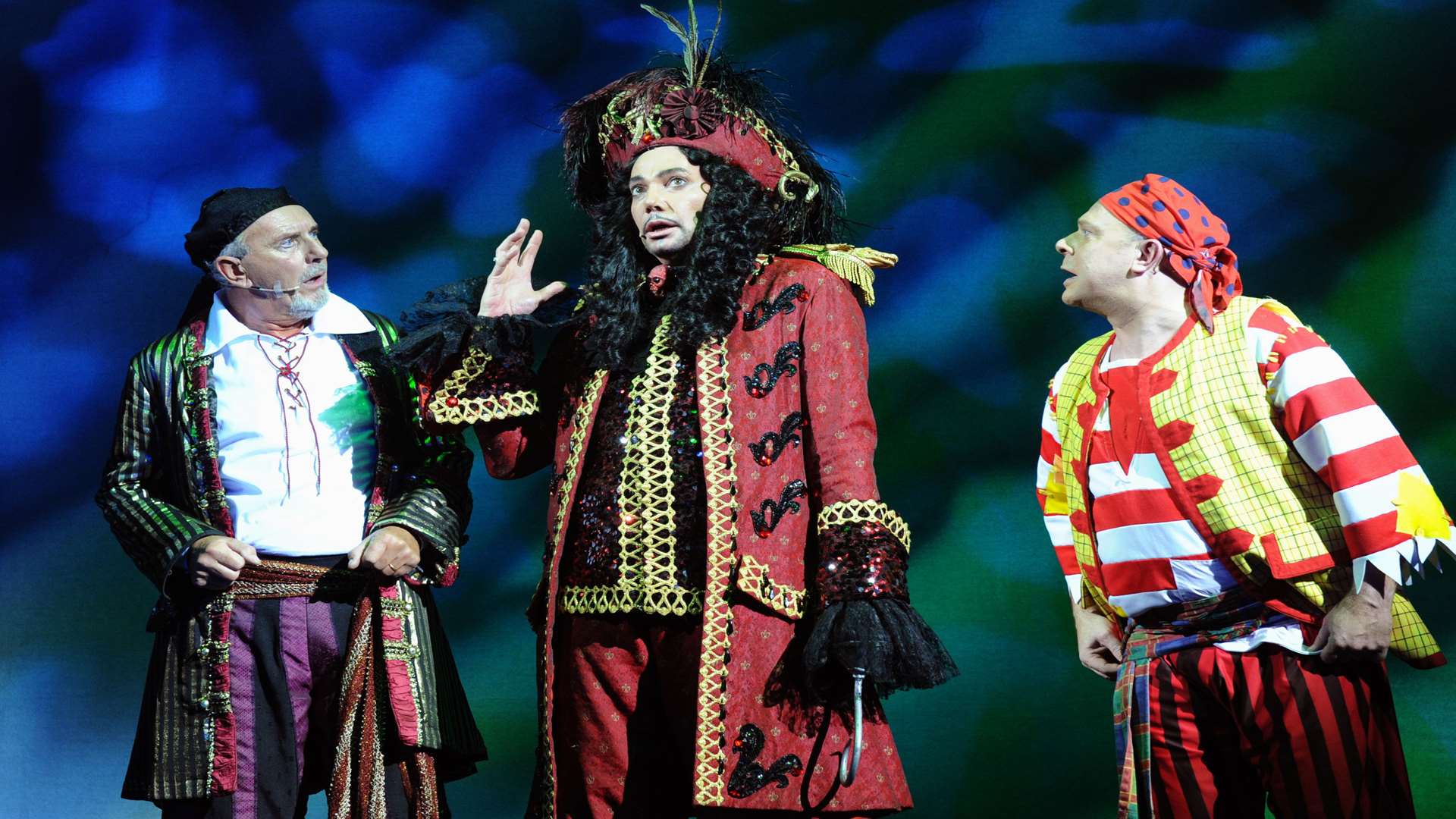 Dawson Chance as Sparkey, left, and Paul Burling as Smee, right, with Craig Revel Horwood as Captain Hook. Picture: Simon Hildrew