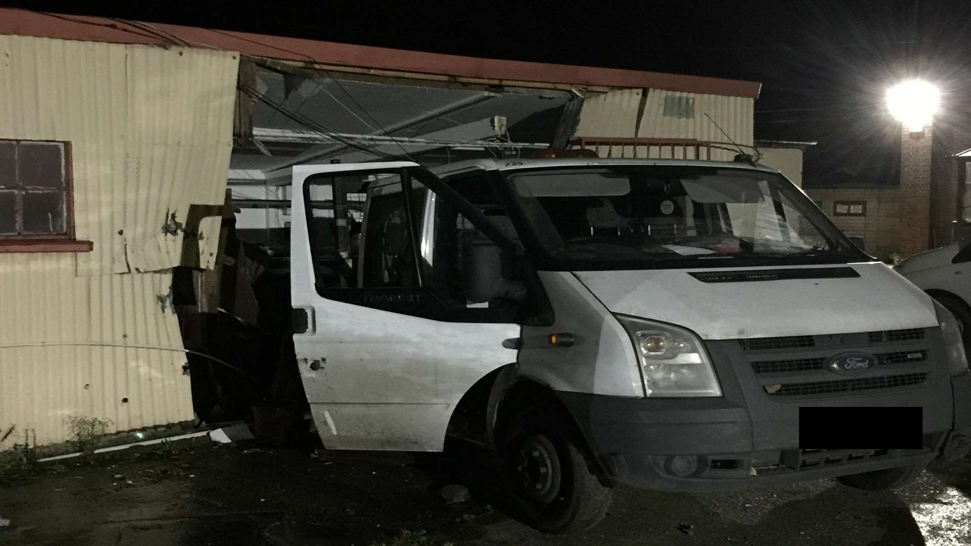 The van smashed into the back of the building.