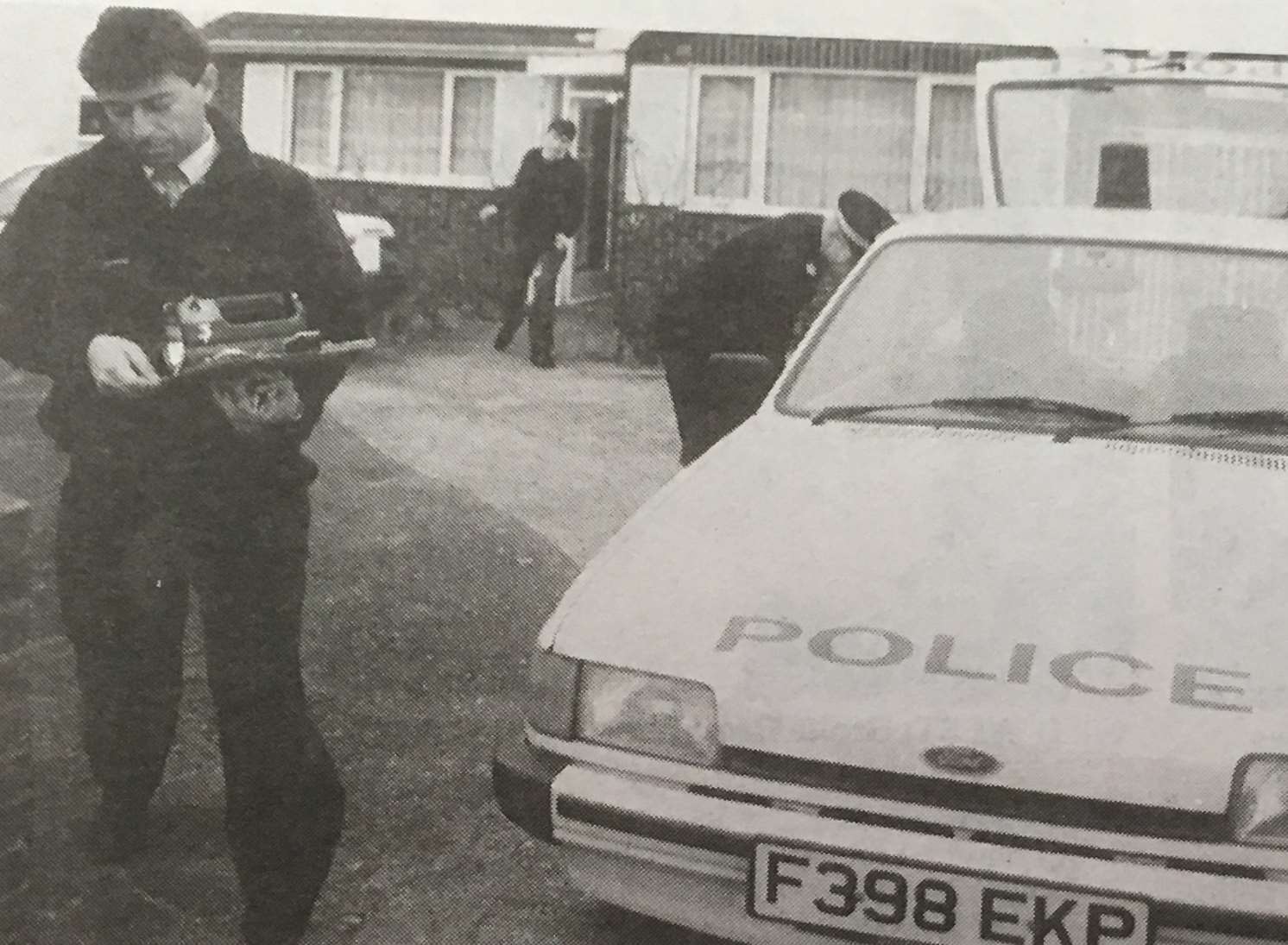 Police at the Rainham bungalow where Acott killed his mother