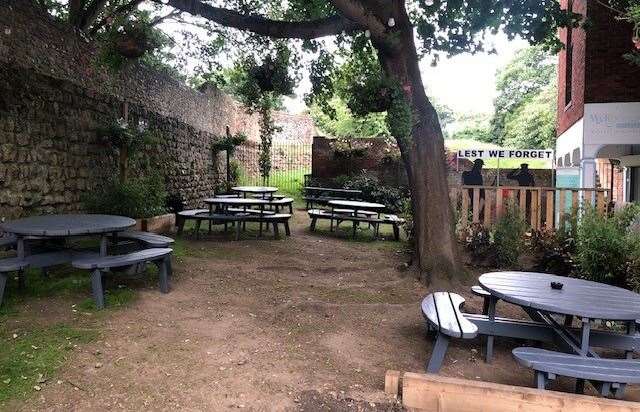 Behind the decking at the back of the bar is a more traditional looking pub garden with freshly varnished picnic tables