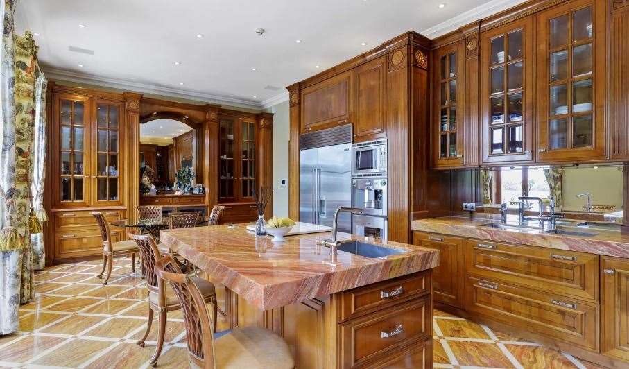 The family kitchen is has a large breakfast bar and high-end appliances. Picture: Knight Frank (59390503)