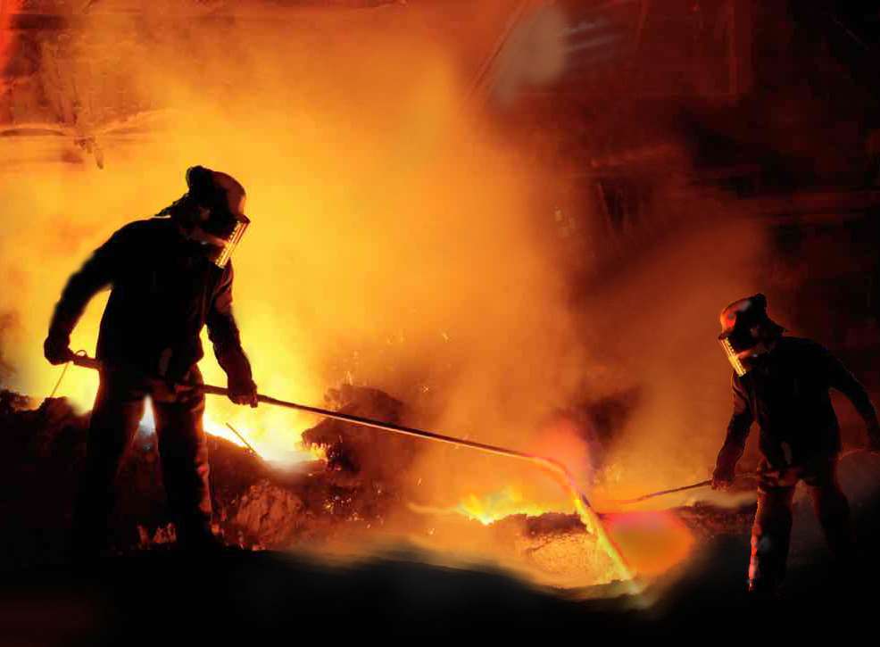 Fires of hell: Workers fuel molten steel with an oxygen lance at melting pot number three. Picture: Studio 137