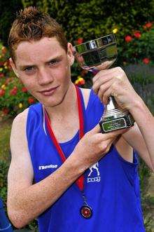 Westlands School pupil Sean Molloy, 13, who will be running in the 800m at The English School Games and English Championships, with his latest trophy and medal,