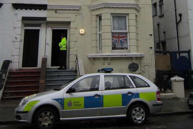 Police standing guard at the house in Athelstan Road, Margate