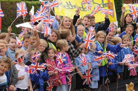 Many schools took the morning off so children could see the relay in Hamstreet. Picture: Wayne McCabe