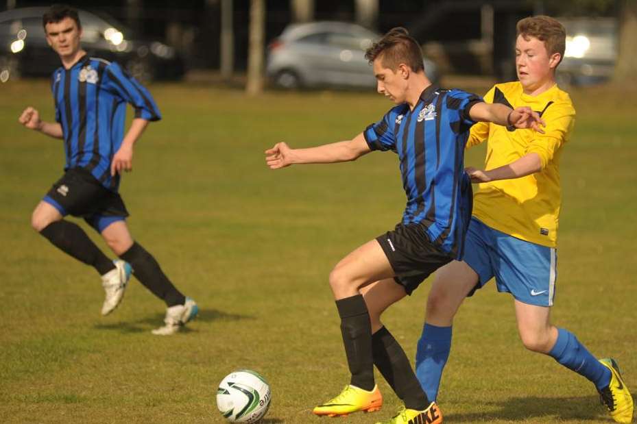 The under-18s of Chatham Riverside (in yellow) and Omega 92 do battle Picture: Steve Crispe