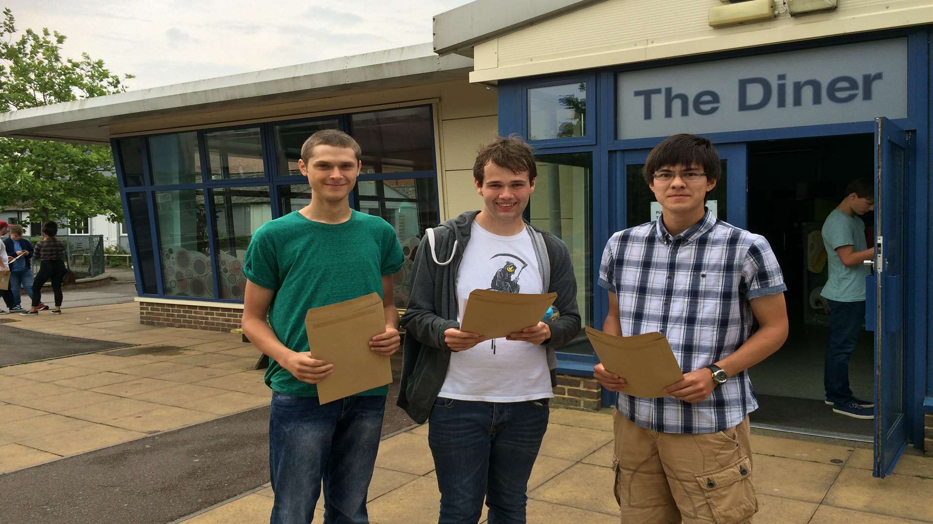 Simon Hulse, Sam Moore and Daniel Seal from Harvey Grammar celebrating their results