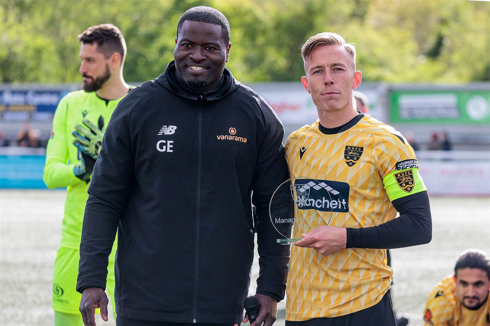 Sam Corne receives the manager's player-of-the-year award from Maidstone boss George Elokobi. Picture: Helen Cooper
