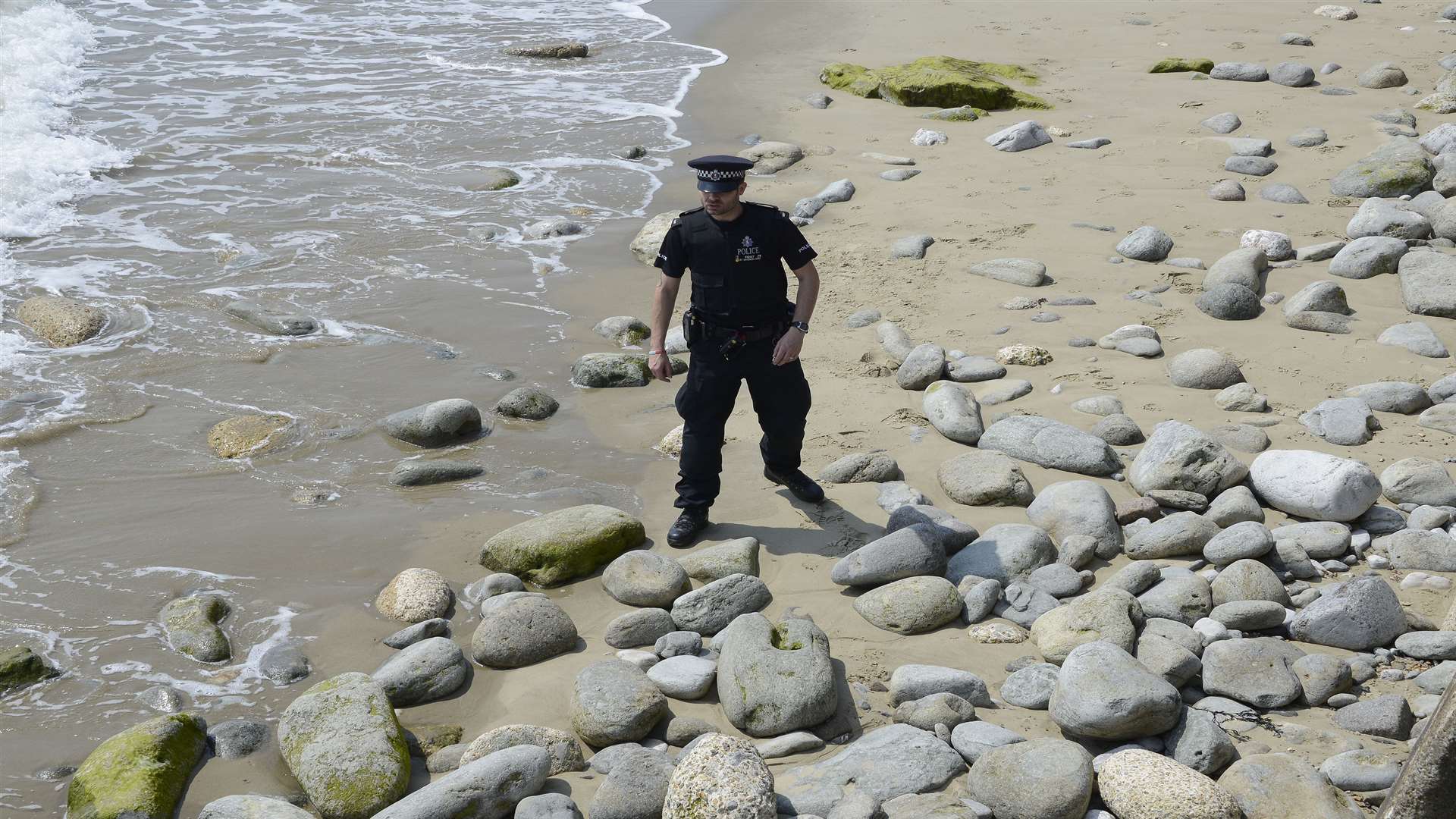 Police searched Sunny Sands beach after the body was found last week. Picture: Paul Amos