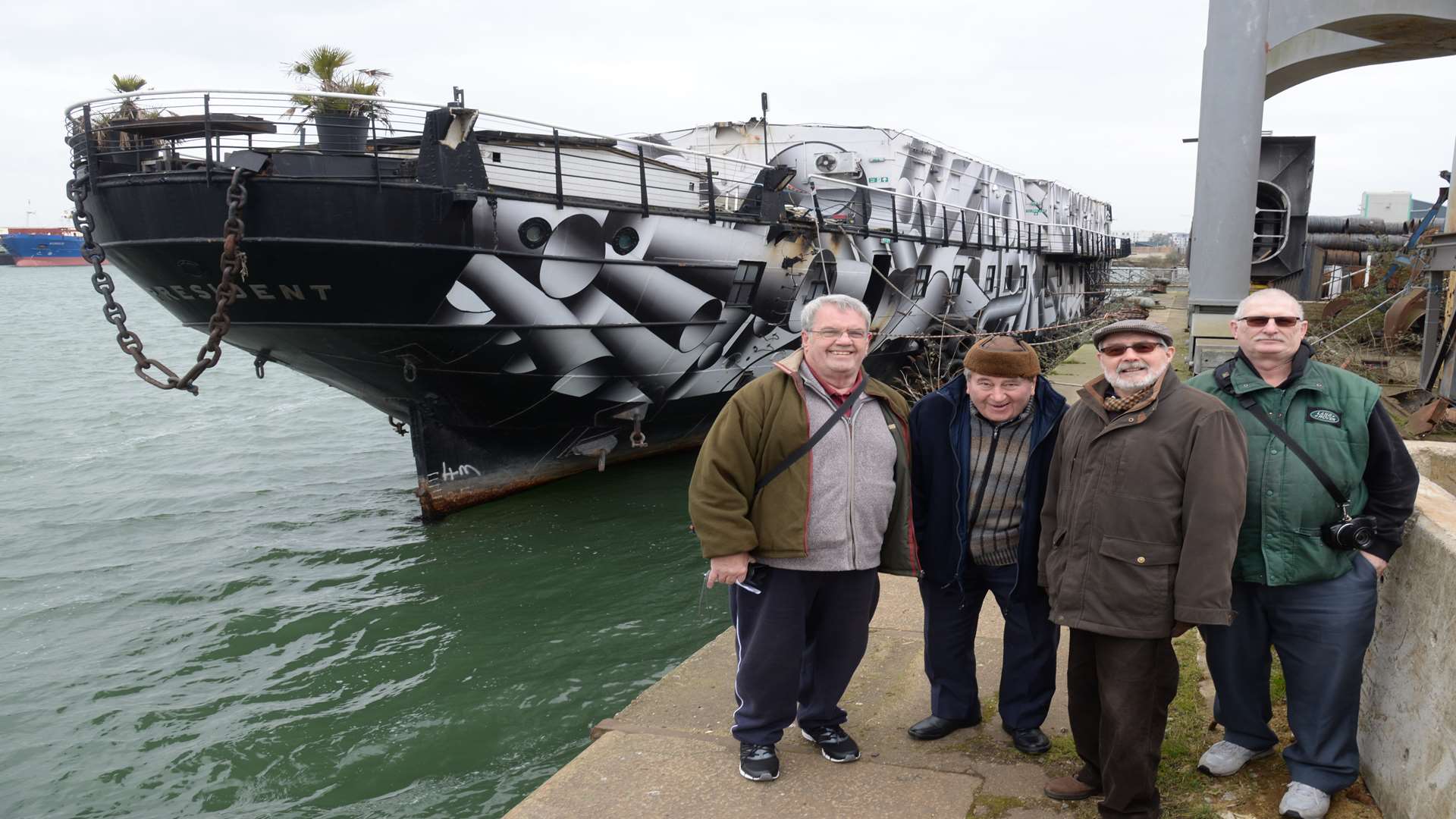 Members of the HMS President Preservation Trust with the ship, currently berthed in Chatham