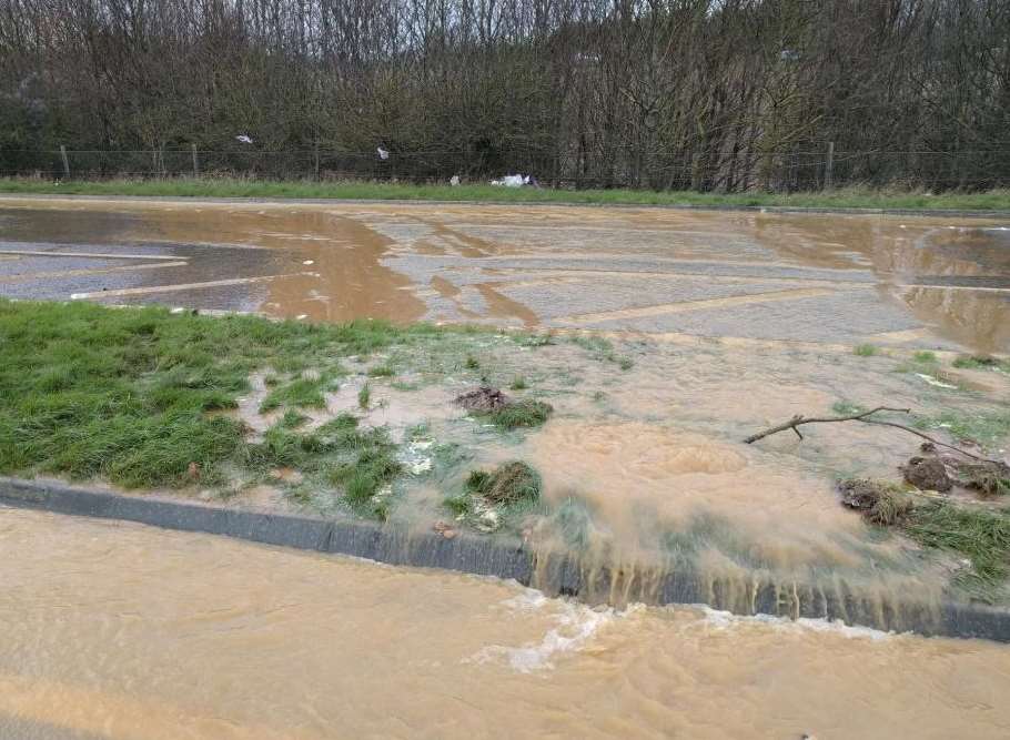 Water from the burst main on the A249. Picture: Highways England