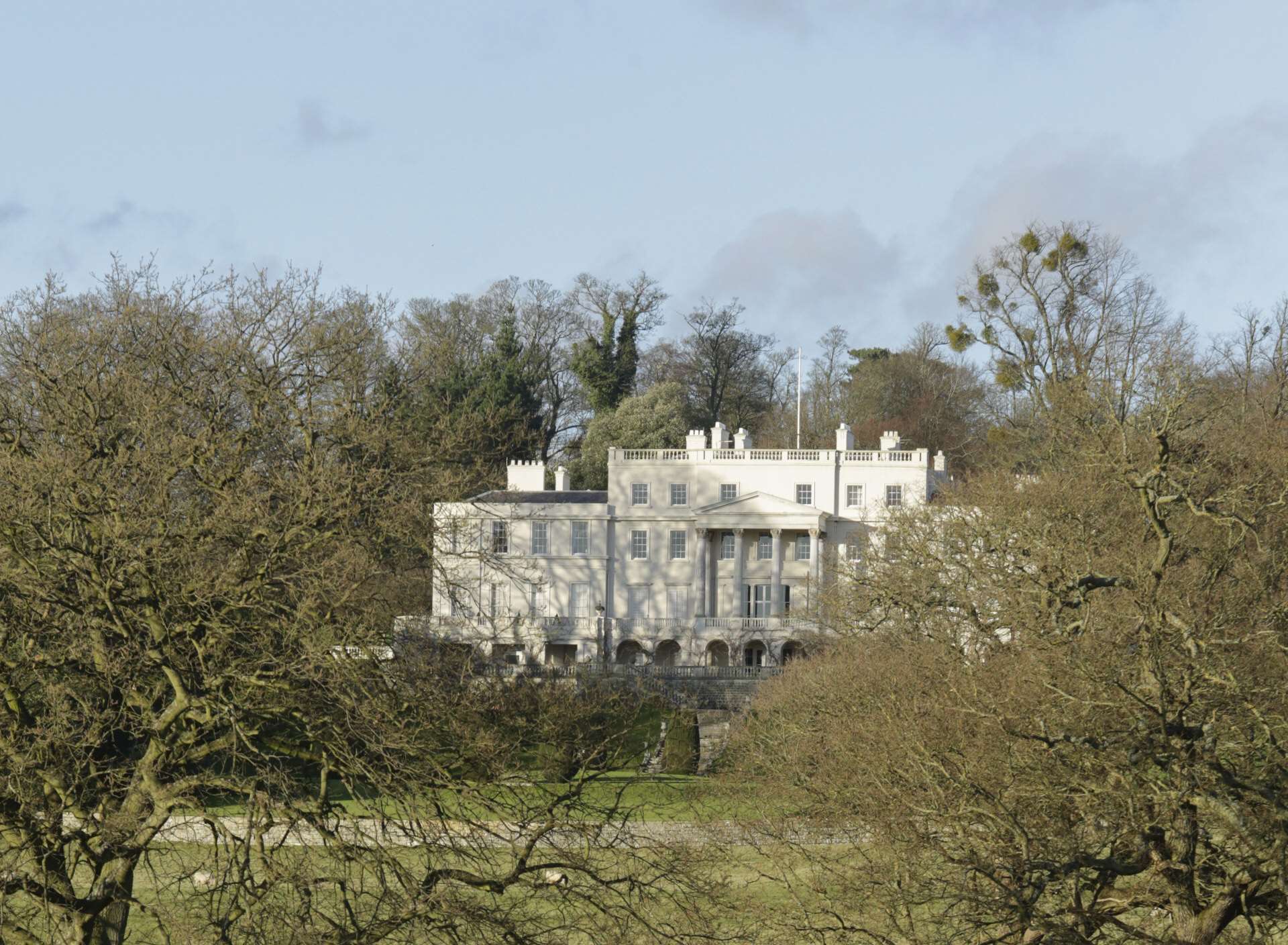 The grand country manor, as seen from surrounding countryside, is a well-recognised feature. Sitting above the park, it is in separate ownership and is not part of the estate being sold.