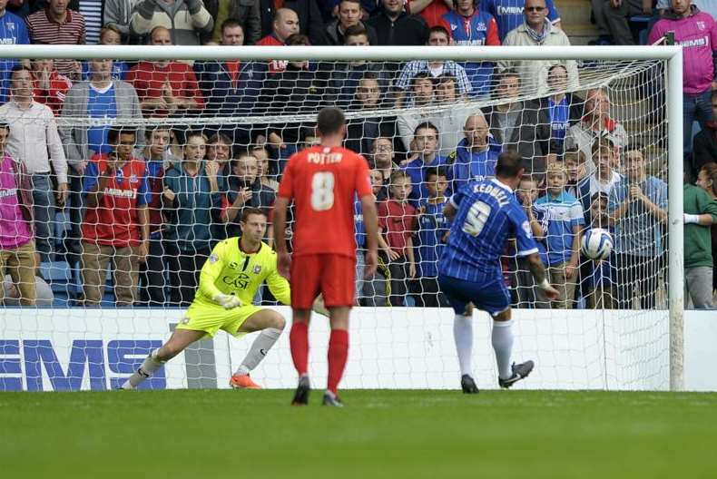 Kedwell scores the first of his two penalties as Gills earn a much-needed three points with a 3-2 win over MK Dons in October 2013 Picture: Barry Goodwin