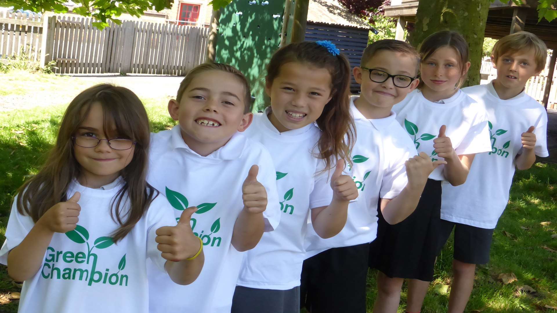 Kelsey Chambers, seven, and friends at Whitstable Junior School celebrate their support of Green Champions.