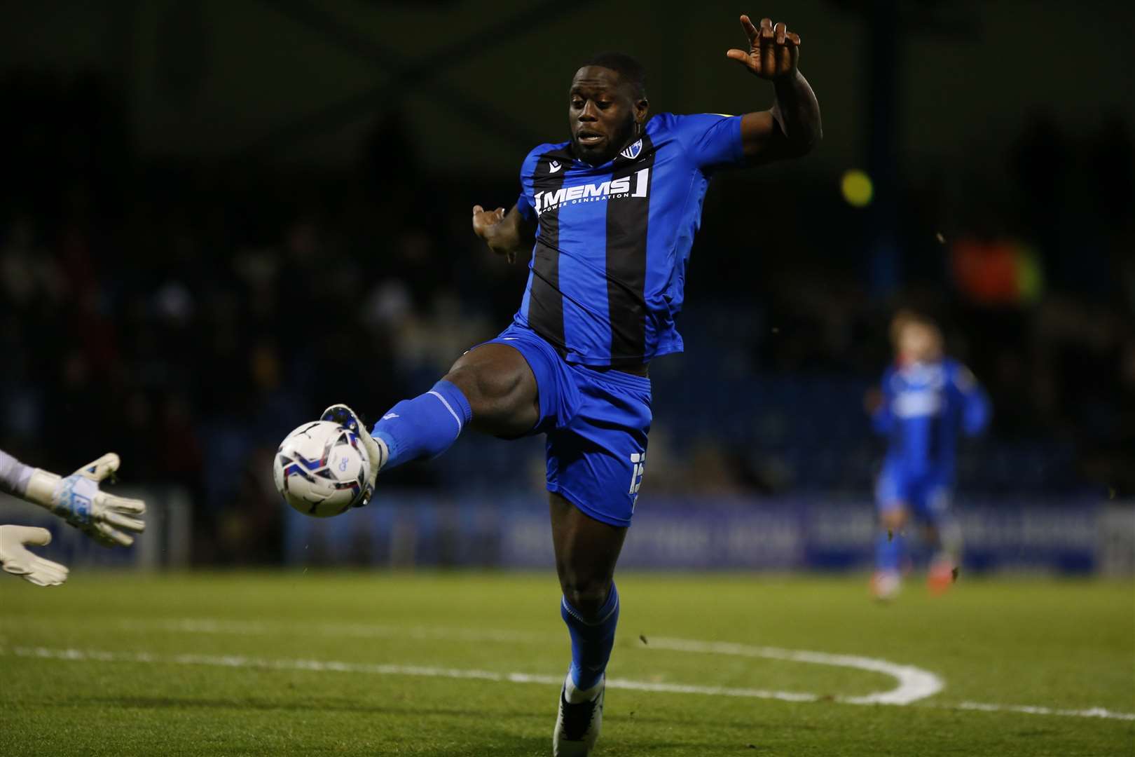John Akinde is about to be cleaned out by the Portsmouth keeper Picture: Andy Jones