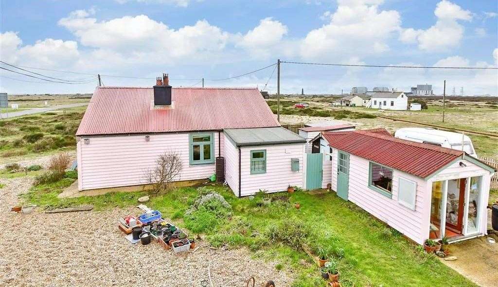 The three-bedroom property is surrounded by shingle beach and a nature reserve. Picture: Wards