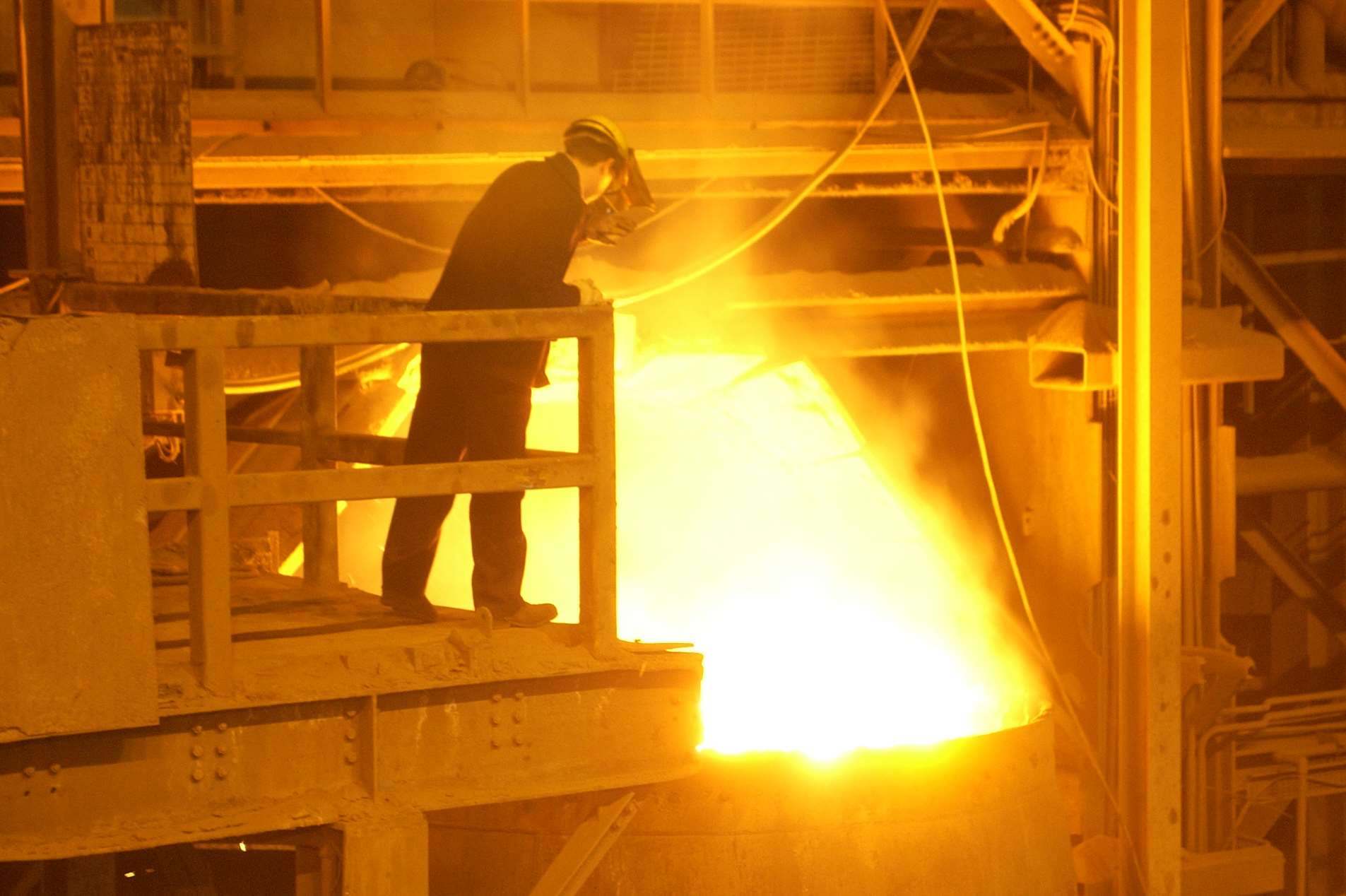 A worker tapping steel at Sheerness Steelworks when it was operational