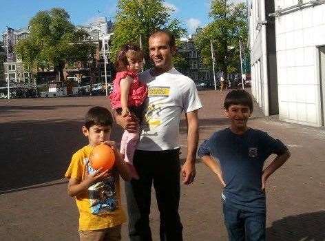 Abdul Mosa holding daughter Arda, with son Ara (left) and son Alin (right), who died in the crash. Picture: Rossparry.co.uk/SWNS.com