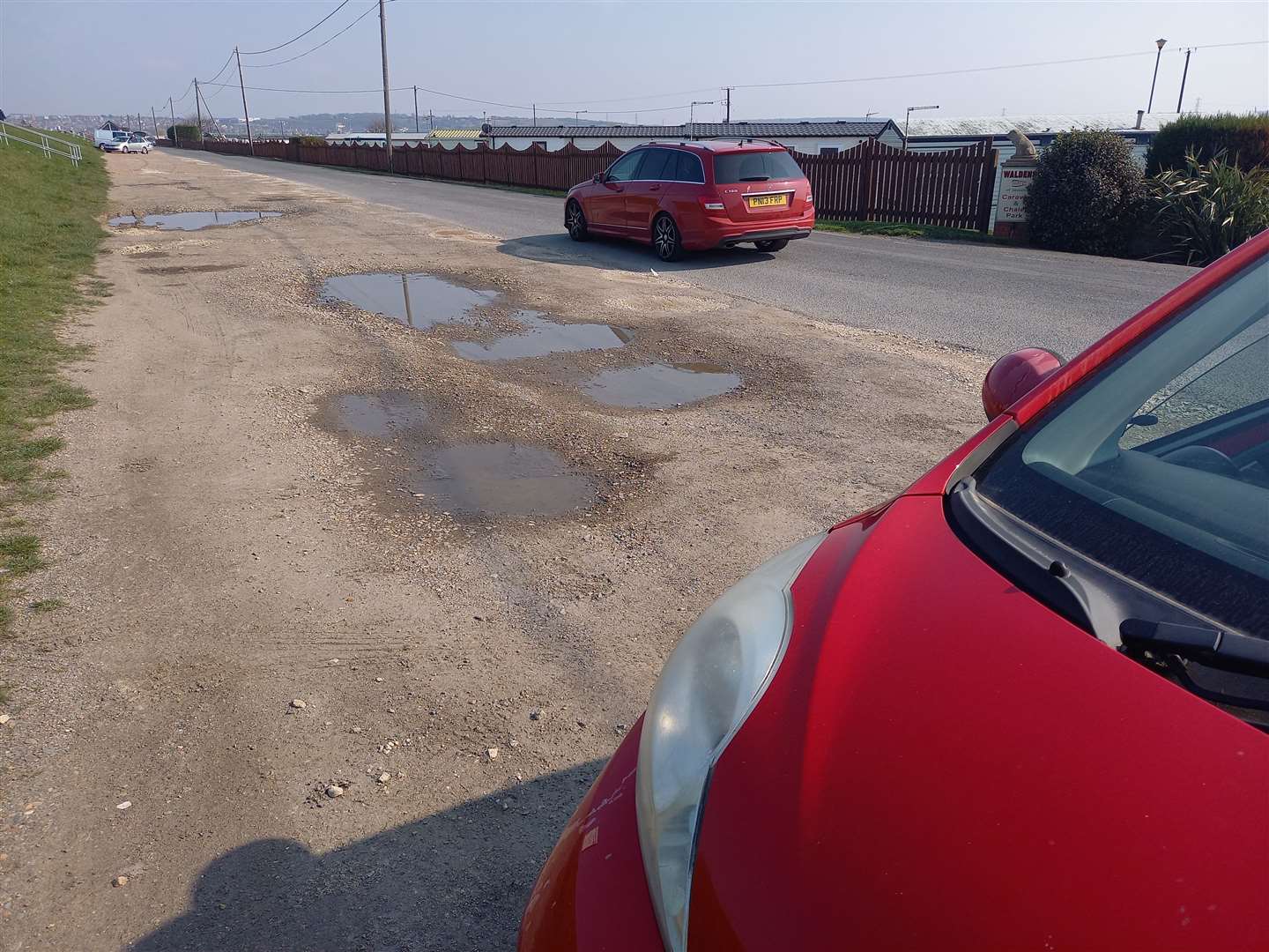 The car park was recently repaired by the council, yet scores of potholes remain
