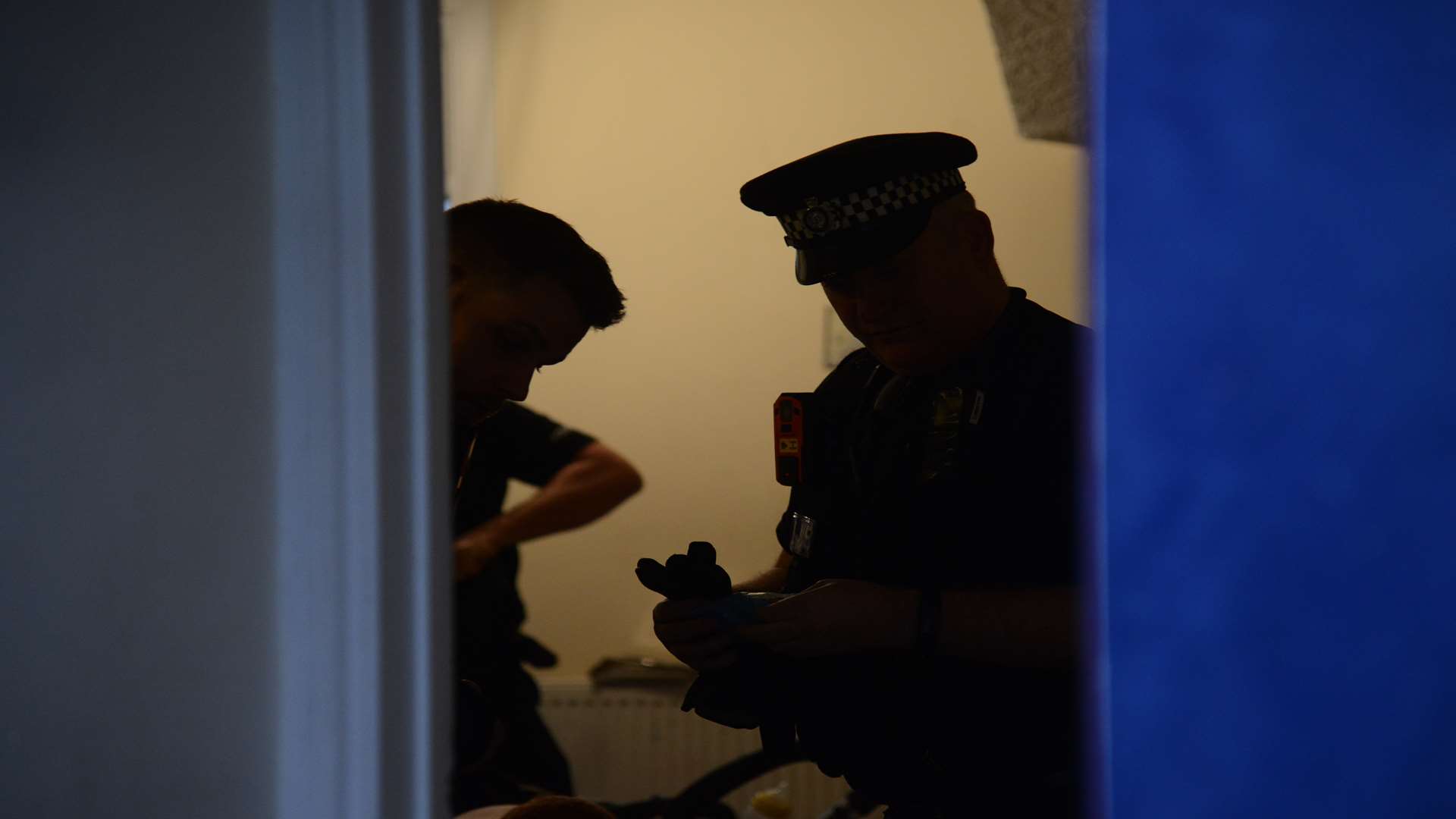Officers search a property in Sheerness as part of the raids which have led to seven arrests, police said