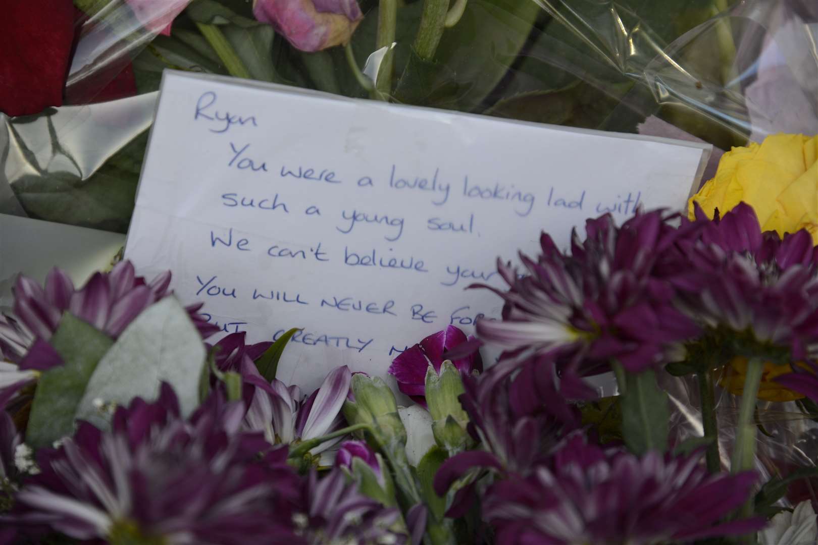 Floral tributes to Ryan were laid on the pavement near the Panorama Building. Picture: Paul Amos