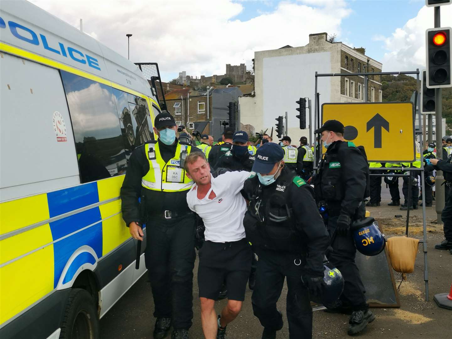 Police detain another protester. Picture: Oliver Kemp