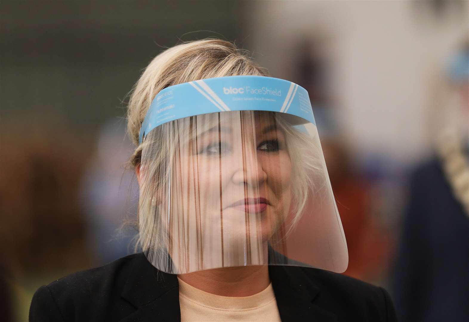 Michelle O’Neill at the Bloc Blinds factory in Magherafelt, where staff are making face shields (Peter Morrison/PA)