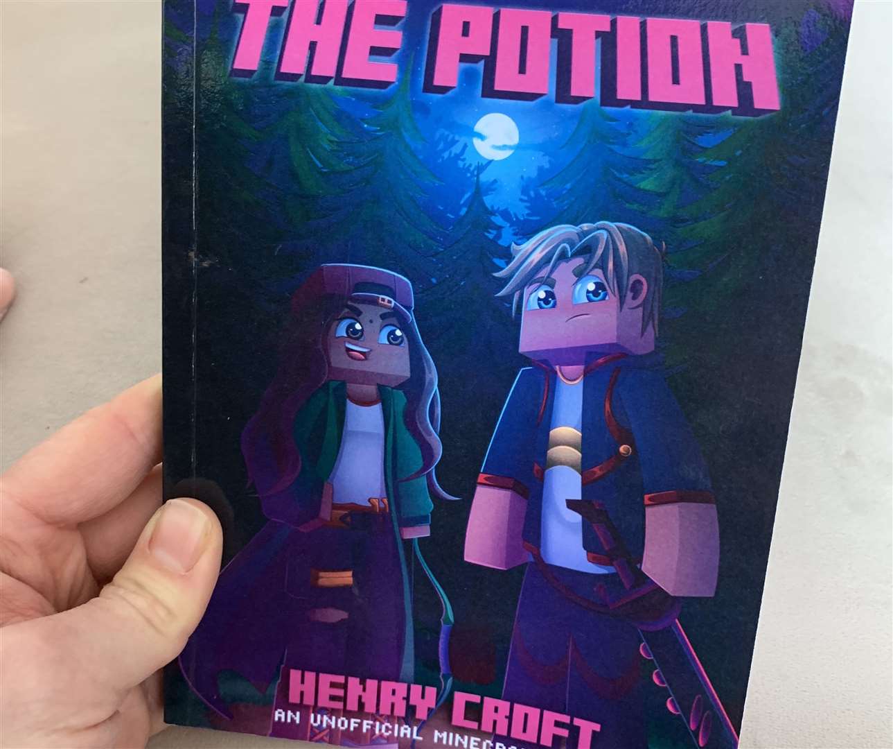 A copy of the book, The Potion - Sucked into Minecraft
