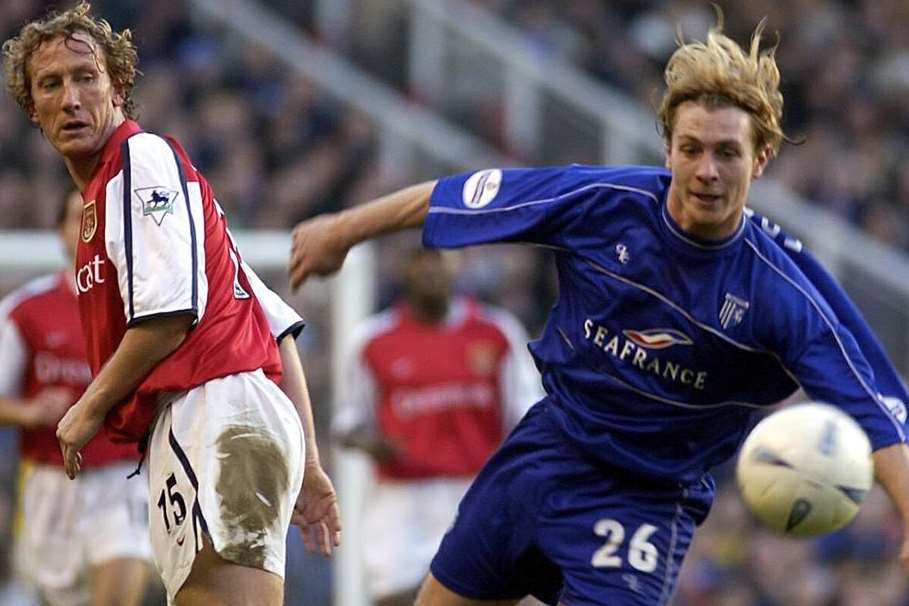 Gillingham's Capital One Cup clash with Newcastle on Tuesday has brought back some memories of famous cup opponents. David Perpetuini takes on Ray Parlour, above, during Gills' 5-2 defeat to Arsenal in the FA Cup fifth round in 2002 Picture: Grant Falvey