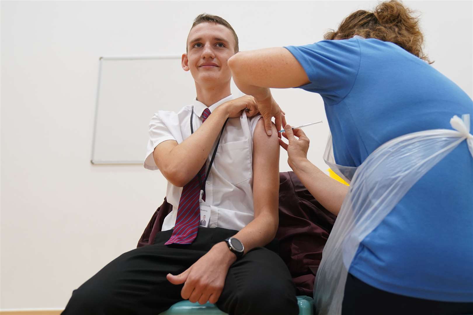 Jack Lane, 14, receiving a Covid-19 vaccination at Belfairs Academy in Leigh-on-Sea, Essex. (Gareth Fuller/ PA)