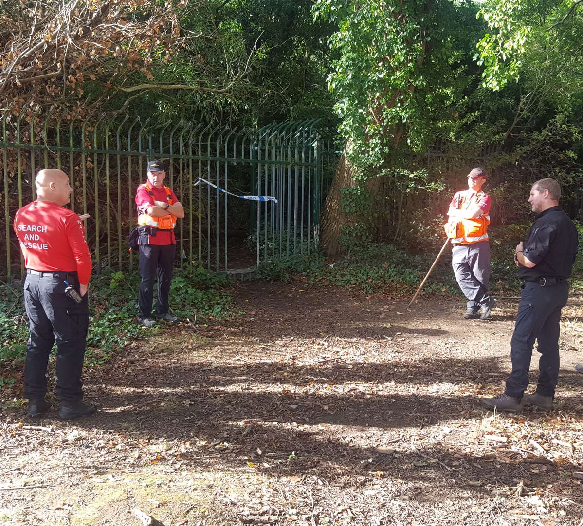 Search and rescue teams at an unofficial entrance to Old Park in Canterbury