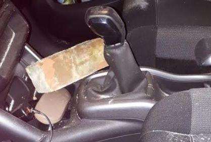 The brick lying next to the gear stick