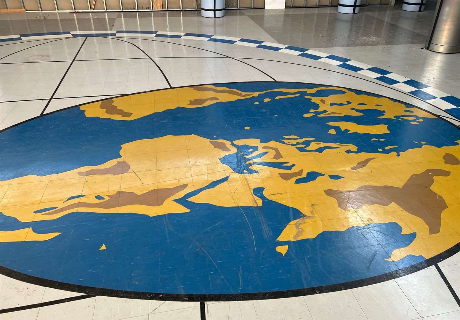 The central 'map of the world' on the floor of the passenger terminal remains