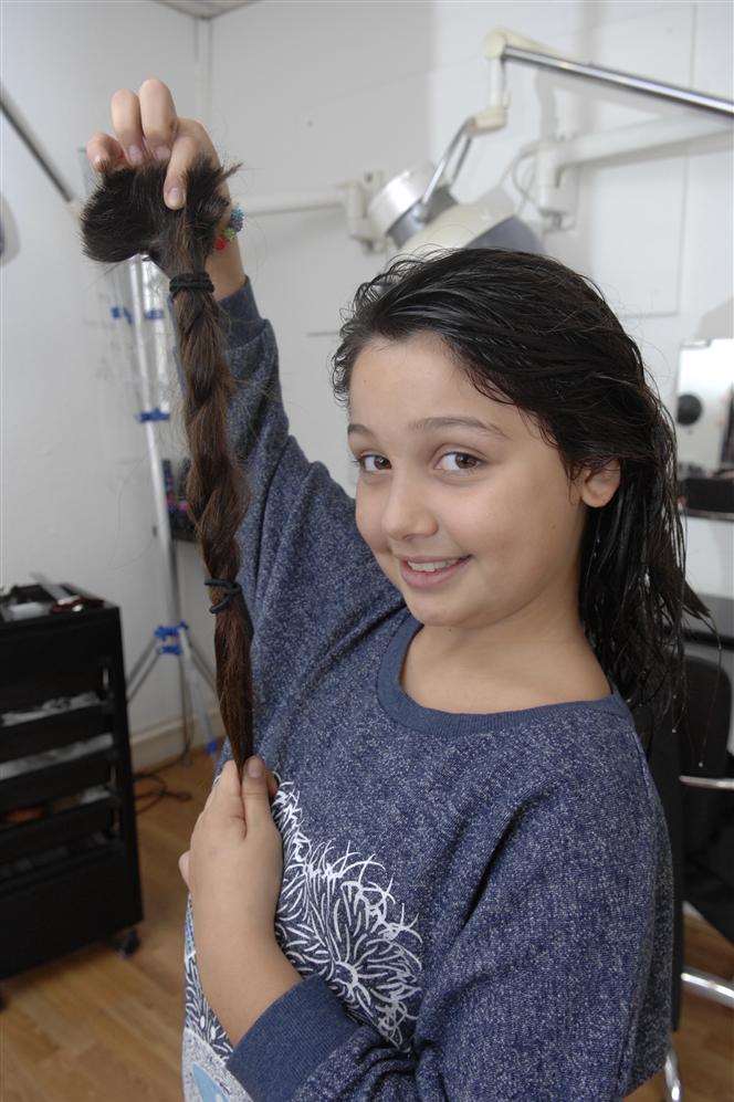 Parted company: Medine Bilgen, 10, and her plait which is on its way to the Little Princess Trust to provide wigs for sick children who have lost their hair.