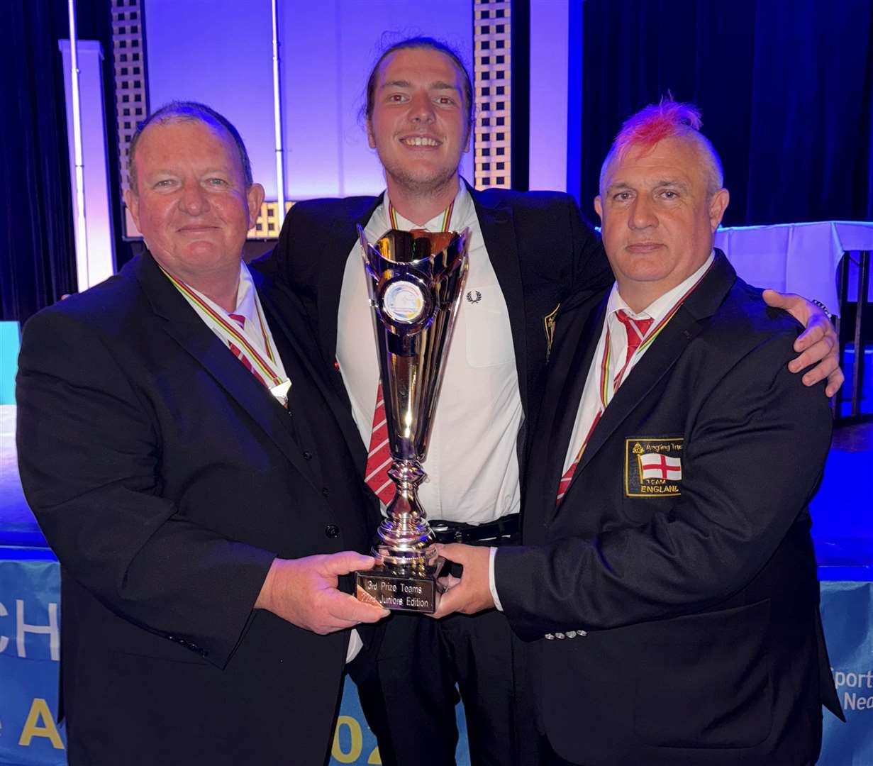 Team manager Mark Slater, left, James Slater, centre, and assistant Mark Preston with the trophy England under-21s won for coming third at a competition held as part of the FIPS-M international series