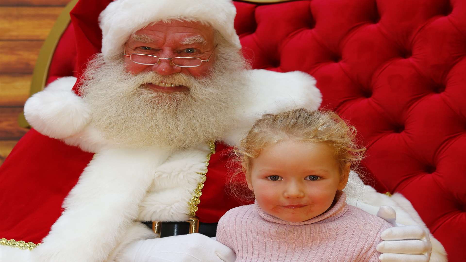 Father Christmas with Ellie Rocamora, aged three, at the Festive Family fun day at Royal Victoria Palace, Tunbridge Wells.