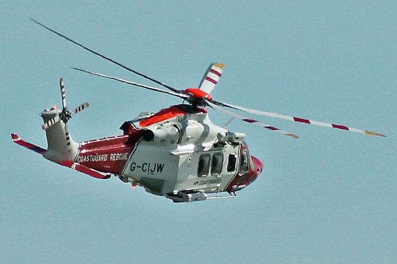 The coastguard rescue helicopter is helping with the operation. Stock picture
