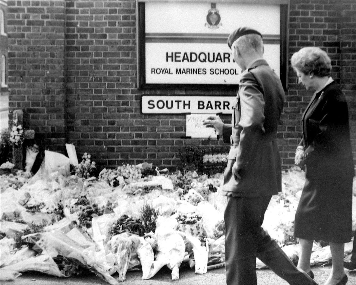 Margaret Thatcher visiting the floral tributes laid at south barracks gate in 1989