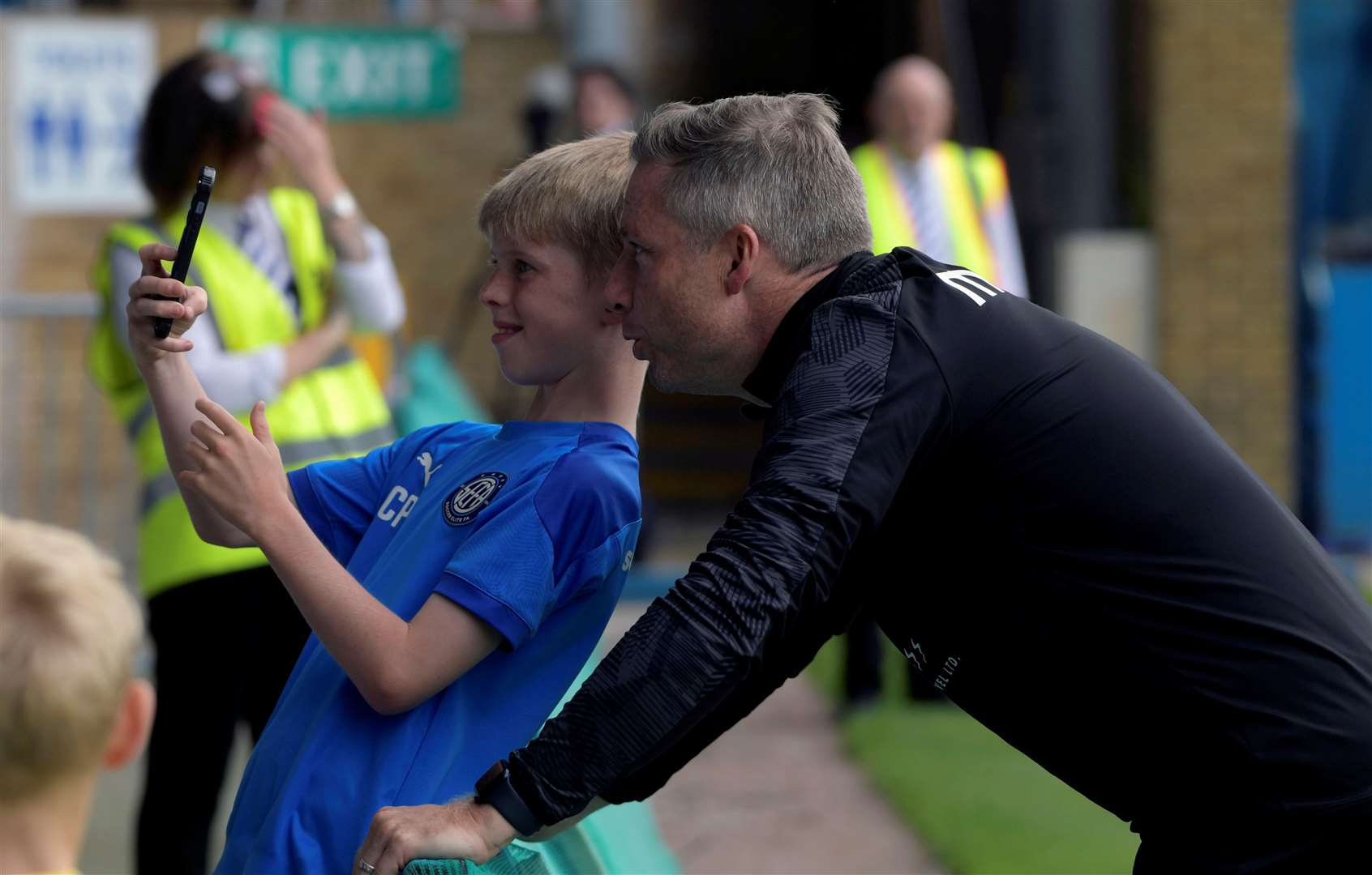 Neil Harris poses for a picture with a young Gillingham fan at an open training session before the start of this season. Picture: Barry Goodwin