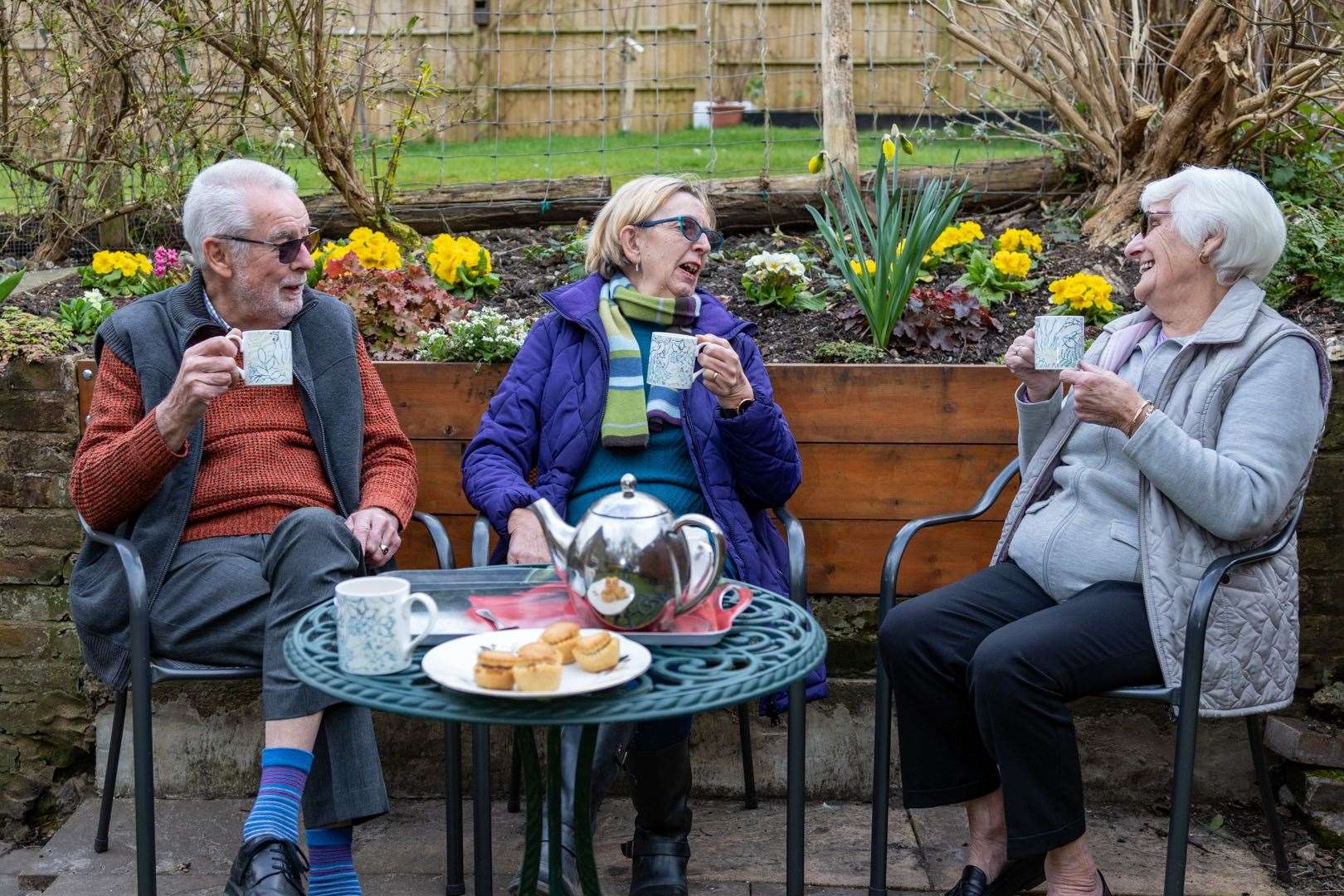 Tony Gostling photographed these neighbours enjoying lockdown tea and hot mince pies in the garden when Covid restrictions were in force