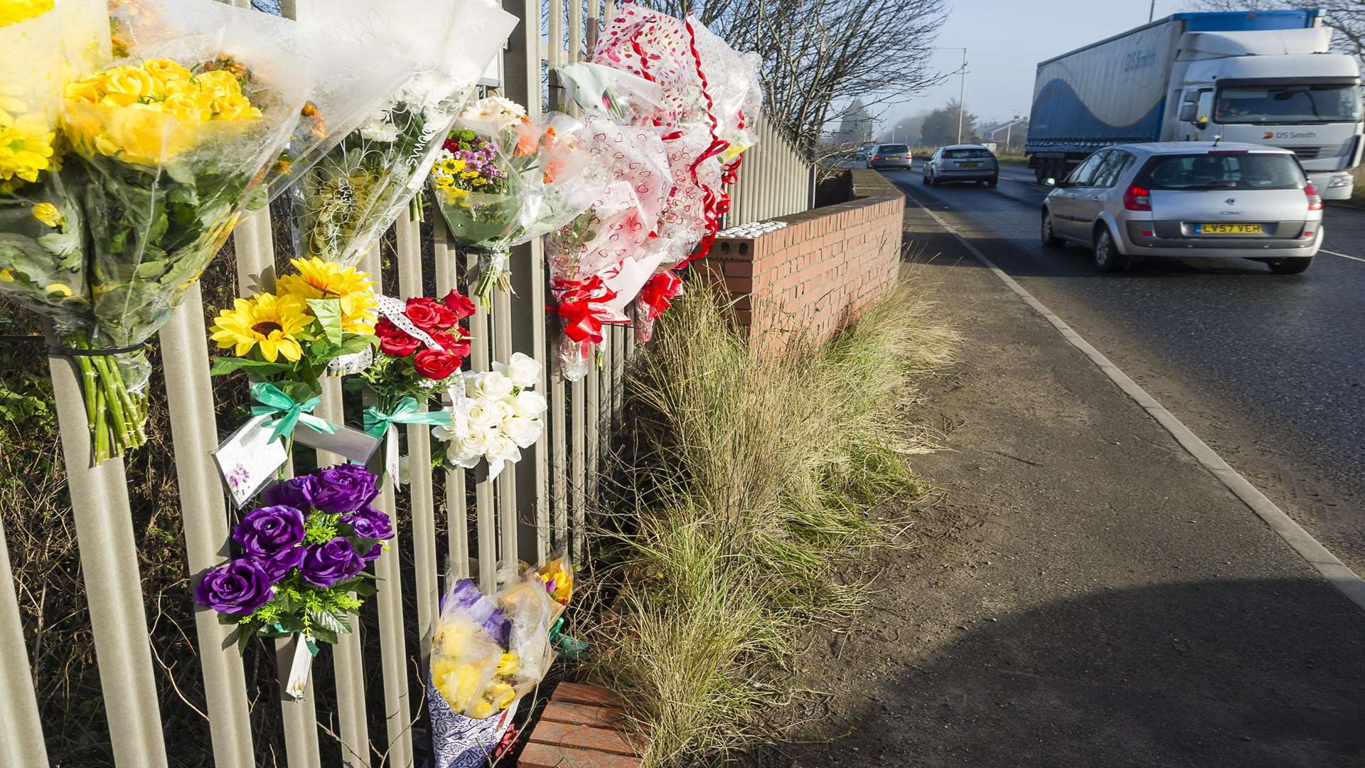 Floral tributes on Brielle Way, Sheerness, to a scooter rider who died of his injuries following a collision