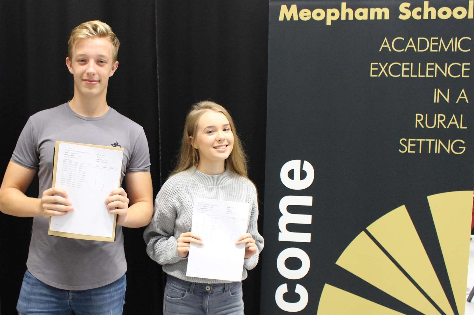 Meopham School's Mitchell Ward and Rebecca Saunders with their GCSE results last summer