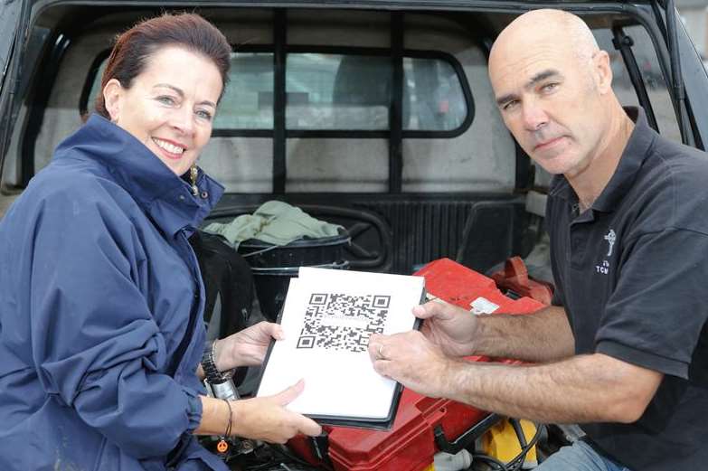 Wendy Nash with stone mason James Taylor of TC Memorials and the QR code